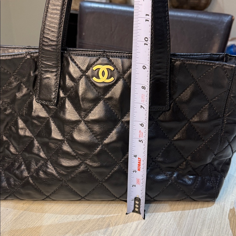 CHANEL Black Quilted Handbag with Gold Accent - Picture 10 of 13